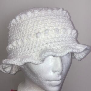 White handmade crochet popcorn hat.